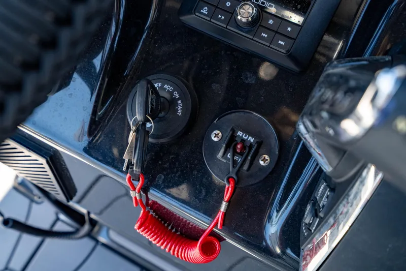 Slide: The Image of Control panel of 2024 Crevalle 26 HCO boat with ignition and run switch. - 31
