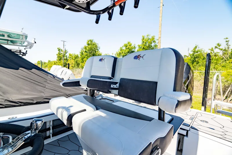 Slide: The Image of 2024 Crevalle 26 HCO boat interior with cushioned seating and modern design. - 33