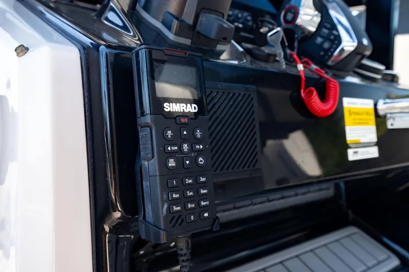 Slide: The Image of Simrad marine radio on 2024 Crevalle 26 HCO boat dashboard. - 34