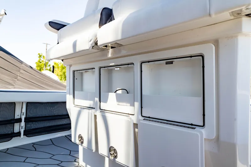 Slide: The Image of 2024 Crevalle 26 HCO boat storage compartments and seating area. - 36