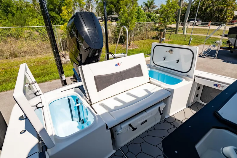 Slide: The Image of 2024 Crevalle 26 HCO boat interior with seating and storage compartments. - 4