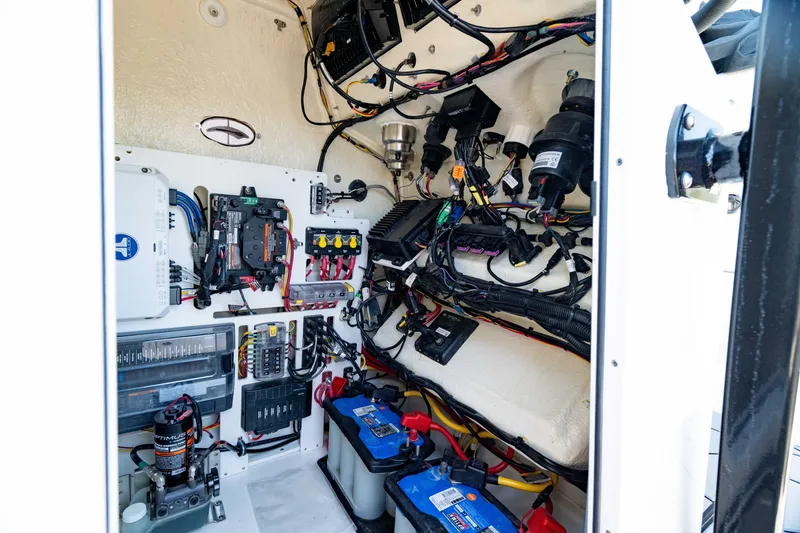 Slide: The Image of 2024 Crevalle 26 HCO boat electrical system with batteries and wiring. - 42