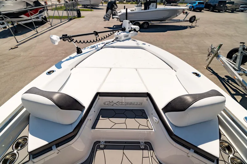 Slide: The Image of 2024 Crevalle 26 HCO boat deck with seating and fishing equipment. - 46
