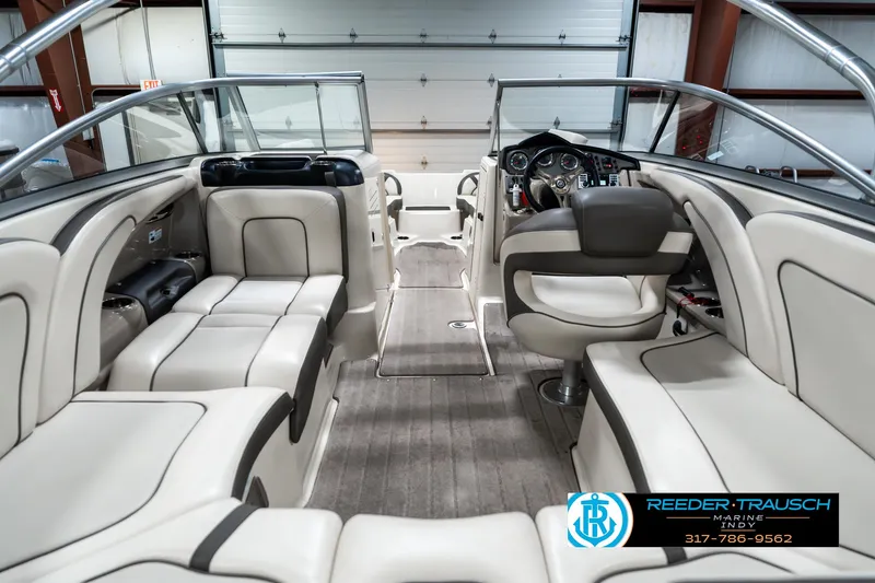 Slide: The Image of 2014 Yamaha Boats 242 Limited S interior with luxurious seating and modern dashboard. - 16