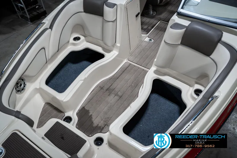 Slide: The Image of 2014 Yamaha Boats 242 Limited S interior with seating and storage compartments. - 22