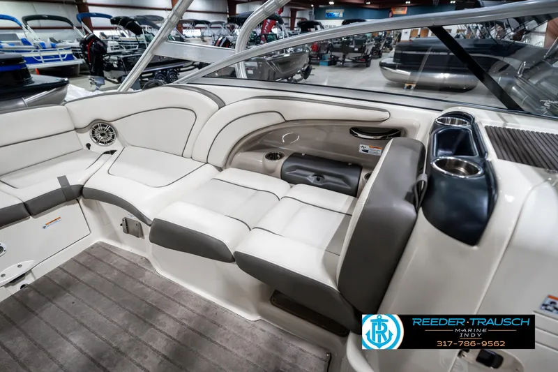 Slide: The Image of 2014 Yamaha Boats 242 Limited S interior with white seating and sleek design. - 27