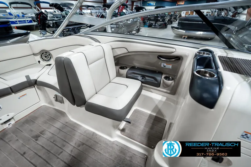 Slide: The Image of Interior of 2014 Yamaha Boats 242 Limited S, featuring beige seating and modern design. - 28