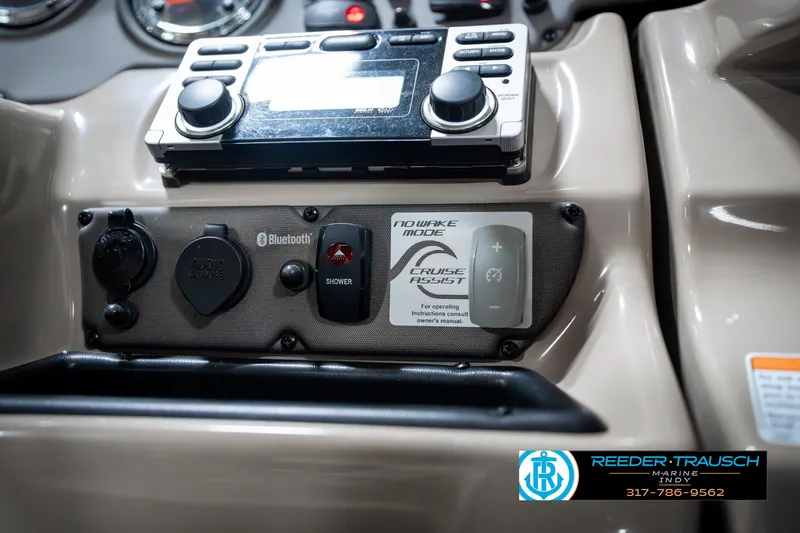 Slide: The Image of Control panel of 2014 Yamaha Boats 242 Limited S with Bluetooth and cruise control features. - 38