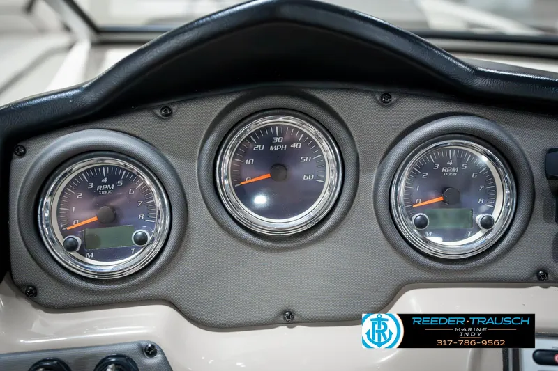 Slide: The Image of Dashboard of a 2014 Yamaha Boats 242 Limited S with speedometer and RPM gauges. - 40