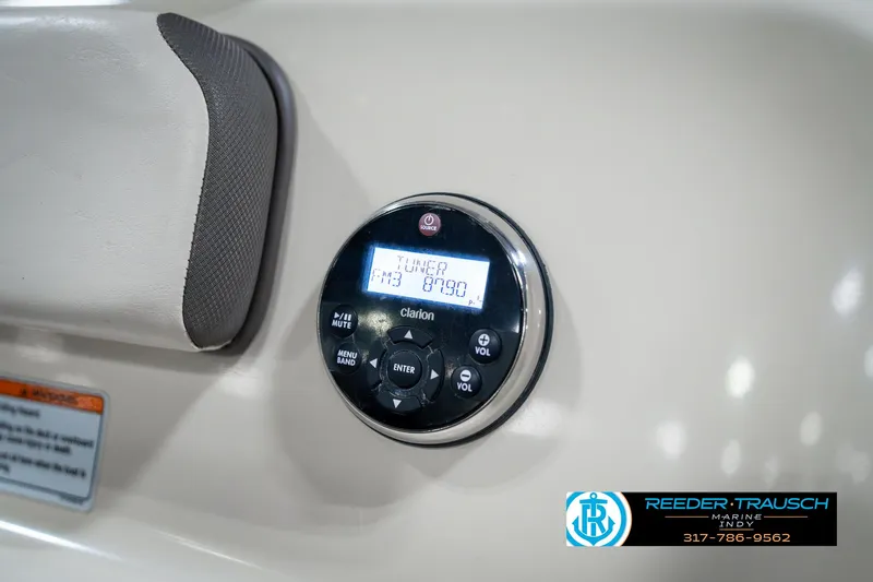 Slide: The Image of Control panel of a 2014 Yamaha Boats 242 Limited S, featuring a Clarion audio system. - 45