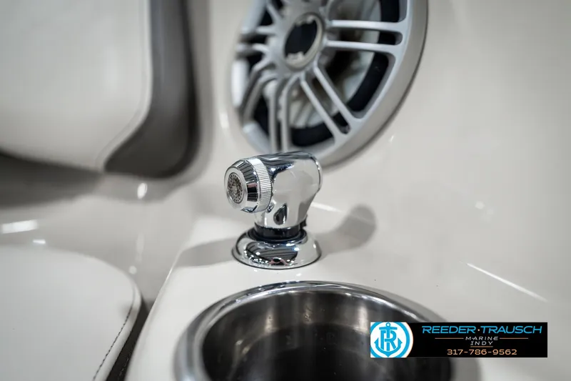 Slide: The Image of 2014 Yamaha Boats 242 Limited S interior detail with speaker and cup holder. - 46