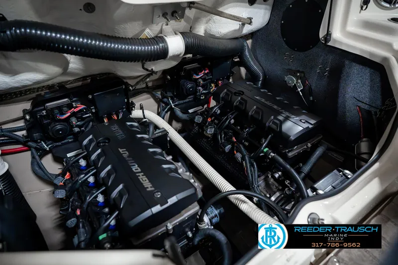 Slide: The Image of Engine compartment of a 2014 Yamaha Boats 242 Limited S, showcasing dual high-output engines. - 47