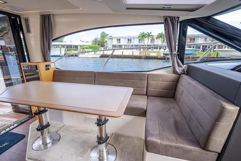 Slide: The Image of Luxurious 2021 Skamander Monaco yacht interior with plush seating and waterfront view. - 11