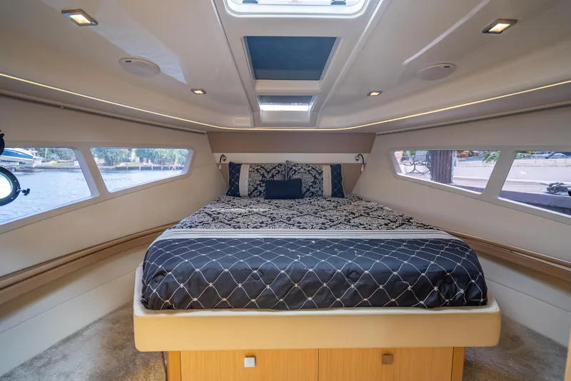 Slide: The Image of Luxurious 2021 Skamander Monaco yacht cabin with elegant bedding and panoramic windows. - 12