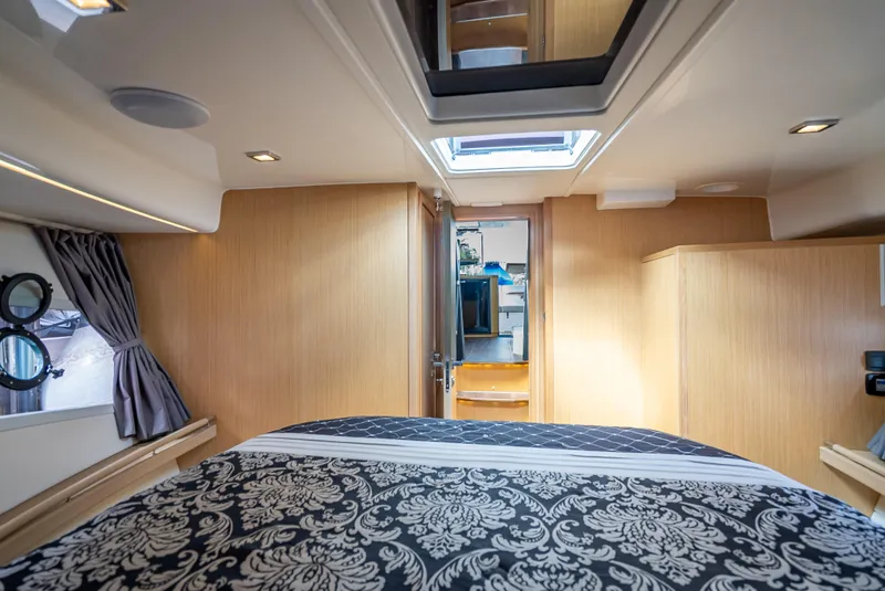 Slide: The Image of Luxurious interior of 2021 Skamander Monaco yacht with elegant bedding and wood paneling. - 14