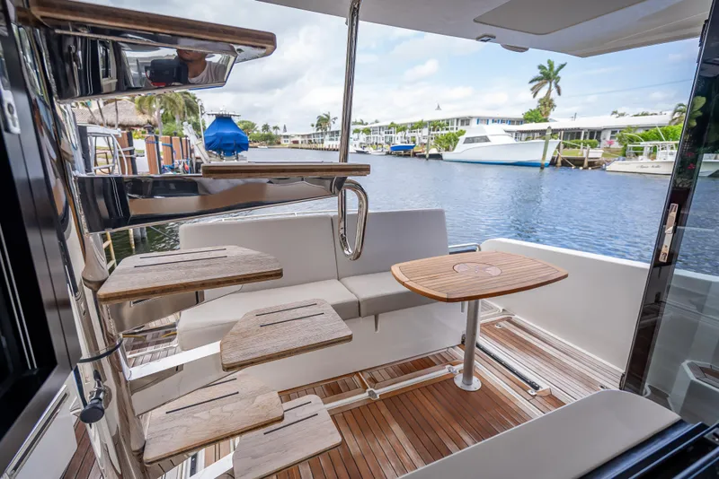 Slide: The Image of Luxurious 2021 Skamander Monaco yacht interior with wooden stairs and waterfront view. - 19