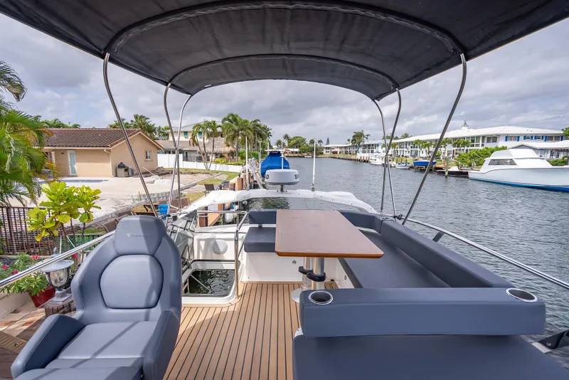 Slide: The Image of Luxurious 2021 Skamander Monaco yacht with spacious seating and elegant design on a scenic canal. - 33