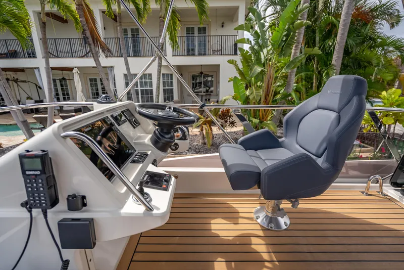 Slide: The Image of Helm of 2021 Skamander Monaco yacht with luxurious seating and modern controls. - 34