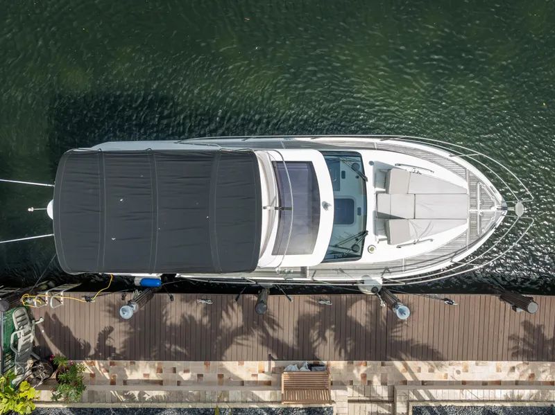 Slide: The Image of Aerial view of 2021 Skamander Monaco yacht docked by a wooden pier. - 35
