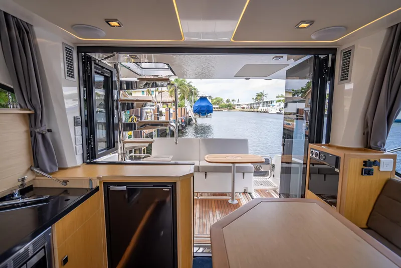 Slide: The Image of Interior view of 2021 Skamander Monaco yacht with open deck and waterfront scenery. - 4