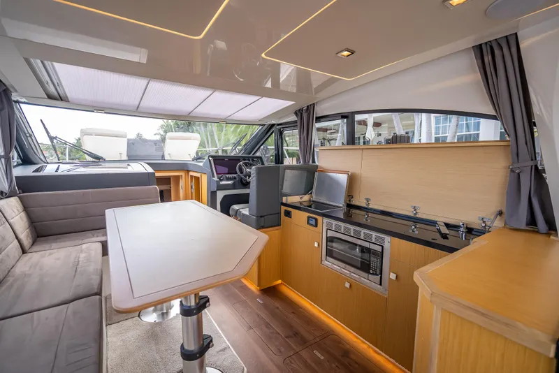 Slide: The Image of Luxurious interior of 2021 Skamander Monaco yacht with modern kitchen and seating area. - 6