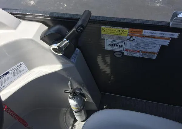 Slide: The Image of 2024 Crest LX 200 SLC boat interior with control panel and safety equipment. - 12