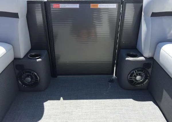 Slide: The Image of 2024 Crest LX 200 SLC boat interior with speakers and seating. - 13