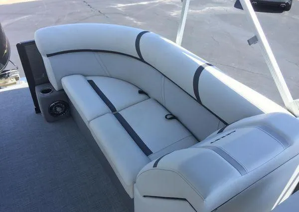 Slide: The Image of 2024 Crest LX 200 SLC boat interior with sleek white seating and modern design. - 17