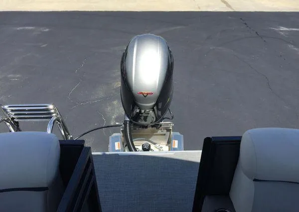 Slide: The Image of 2024 Crest LX 200 SLC boat with outboard motor and seating, viewed from the rear. - 21