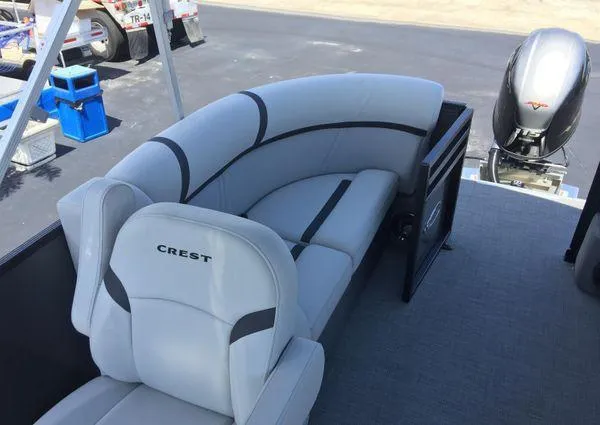 Slide: The Image of 2024 Crest LX 200 SLC boat interior with plush seating and modern design. - 22