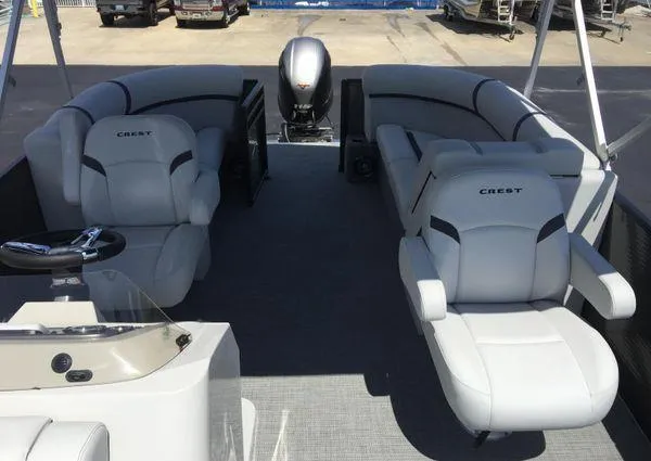 Slide: The Image of 2024 Crest LX 200 SLC pontoon boat interior with plush seating and modern design. - 24