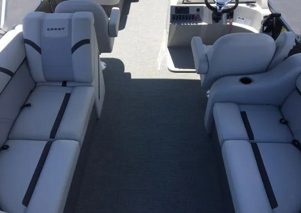 Slide: The Image of 2024 Crest LX 200 SLC boat interior with gray seating and steering console. - 28