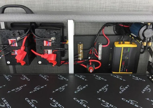 Slide: The Image of 2024 Crest Classic LX 220 SLSC boat storage compartment with sleek design and secure lock. - 14