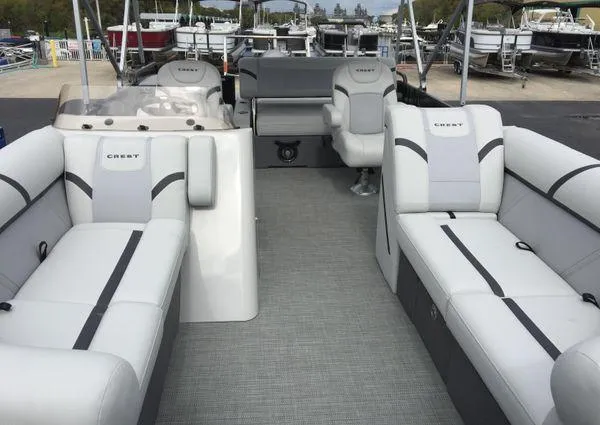Slide: The Image of 2024 Crest Classic LX 220 SLSC boat interior with sleek white seating. - 21