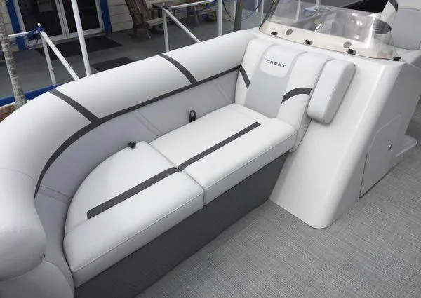 Slide: The Image of 2024 Crest Classic LX 220 SLSC pontoon boat with Yamaha outboard motor, docked near a deli. - 22