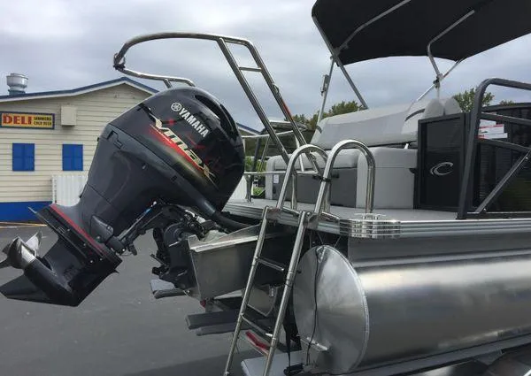 Slide: The Image of 2024 Crest Classic LX 220 SLSC boat interior with white and gray seating. - 23