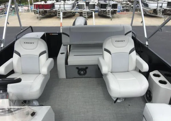 Slide: The Image of 2024 Crest Classic LX 220 SLSC boat interior with plush seating and modern design. - 27