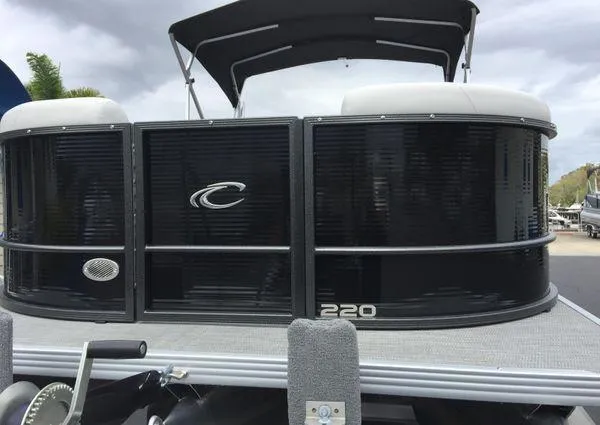 Slide: The Image of 2024 Crest Classic LX 220 SLSC boat dashboard with steering wheel and control panel. - 5