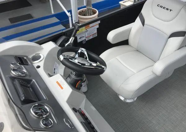 Slide: The Image of 2024 Crest Classic LX 220 SLSC boat interior with plush seating and modern design. - 8