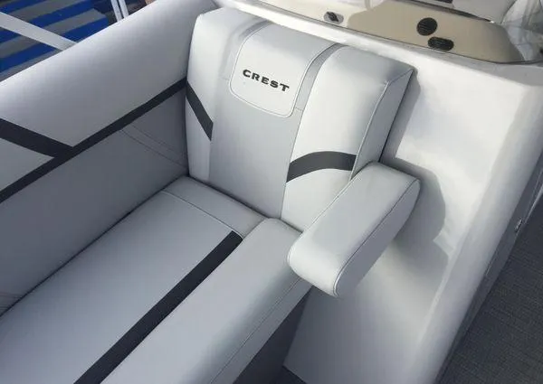 Slide: The Image of 2024 Crest LX 220 SLRC boat seat with sleek white and gray upholstery. - 10