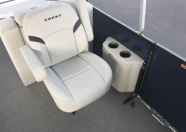 Slide: The Image of 2024 Crest LX 220 SLRC boat seat with cup holders, featuring sleek white upholstery. - 11