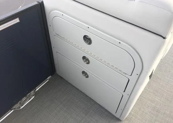 Slide: The Image of 2024 Crest LX 220 SLRC boat interior with sleek storage compartments. - 12