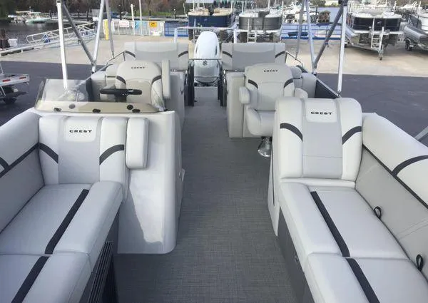 Slide: The Image of 2024 Crest LX 220 SLRC pontoon boat with spacious seating and modern design. - 16