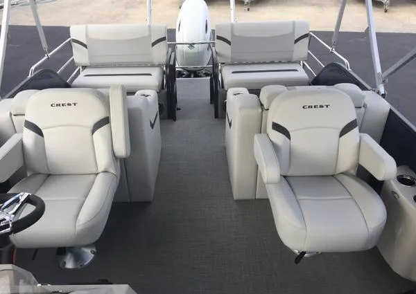 Slide: The Image of 2024 Crest LX 220 SLRC pontoon boat interior with plush seating and modern design. - 20