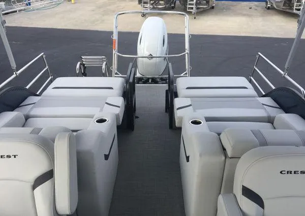 Slide: The Image of 2024 Crest LX 220 SLRC pontoon boat interior with plush seating and modern design. - 21