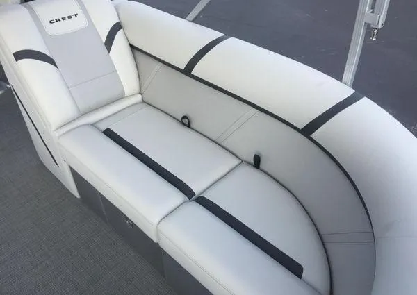 Slide: The Image of 2024 Crest LX 220 SLRC boat seat, white and gray upholstery, modern design. - 22
