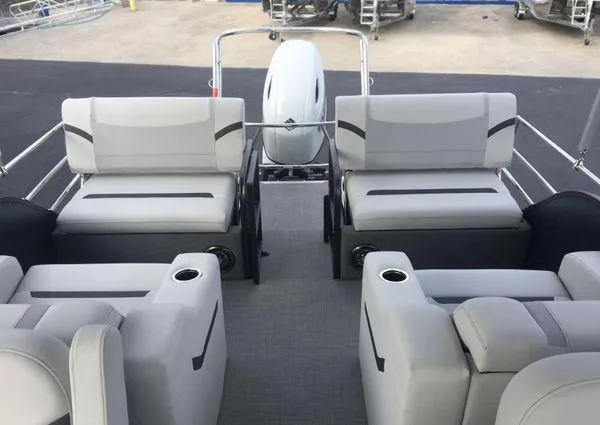 Slide: The Image of 2024 Crest LX 220 SLRC pontoon boat interior with gray seating and cup holders. - 23