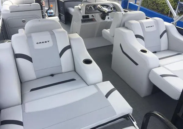 Slide: The Image of 2024 Crest LX 220 SLRC boat interior with plush seating and modern dashboard. - 25