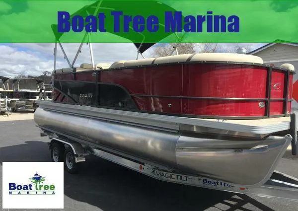 Slide: The Image of 2024 Crest LX 220 SLC pontoon boat on trailer at Boat Tree Marina. - 1