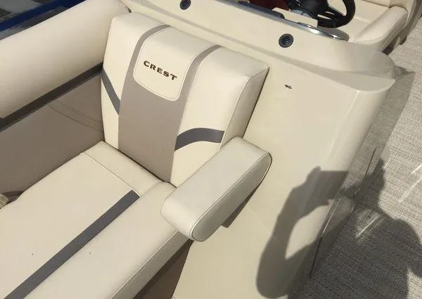 Slide: The Image of 2024 Crest LX 220 SLC boat seat with beige and gray upholstery. - 11